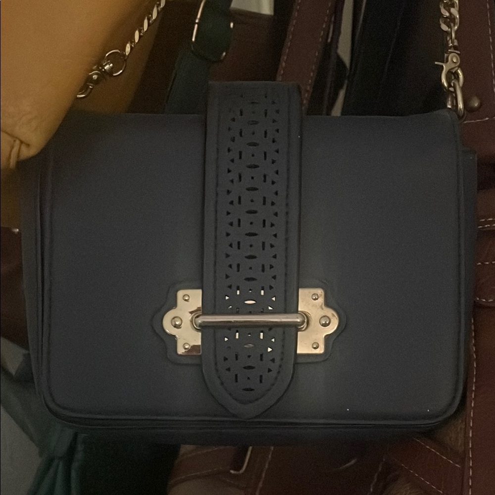 Blue Crossbody Bag with Chain Strap and Decorative Closure